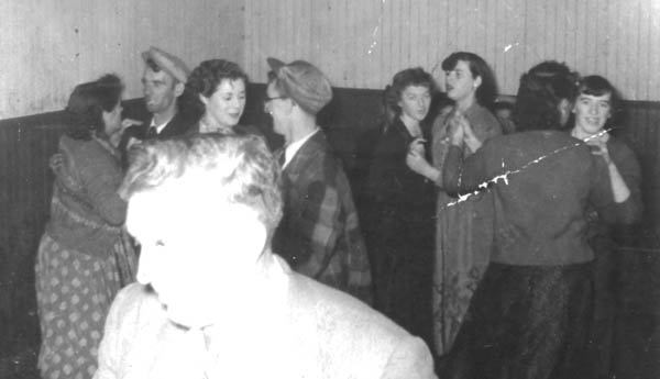 445: A dance at Red Island. l-r dancing Cecilia (Cheeseman) Kerrivan &amp;amp; John Whelan, Angela Ryan  &amp;amp; Adrian Ryan, Gertude Ryan &amp;amp; Noreen Ryan, unidentified (back to camera) &amp;amp;  Babe Ennis. (circa 1954-1956) [courtesy of Betty (Carroll) Spurvey]  - Cecilia daughter of Joseph Cheeseman &amp;amp; Anna Ryan; John son of Thomas Whelan  &amp;amp; Anne Barry; Angela daughter of Michael Ryan &amp;amp; Petronella Whelan; Adrian and  Noreen children of Albert Ryan &amp;amp; Catherine Nolan; Gertrude daughter of Jeremiah  Ryan &amp;amp; Josephine Lambe; Babe (Norah) daughter of Vincent Ennis &amp;amp; Mary Carroll